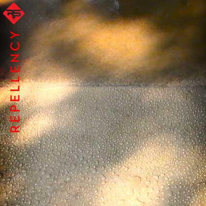 Water bead on concrete surface.