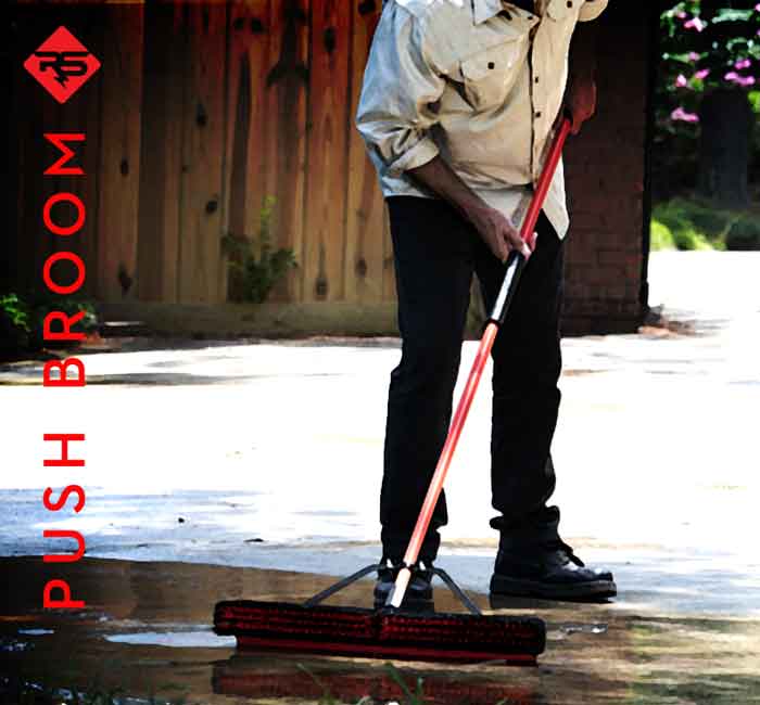 Use a push broom to work RadonSeal into the concrete.