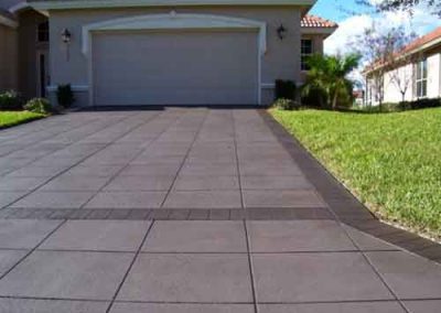 Semi-translucent stain applied to concrete driveway.