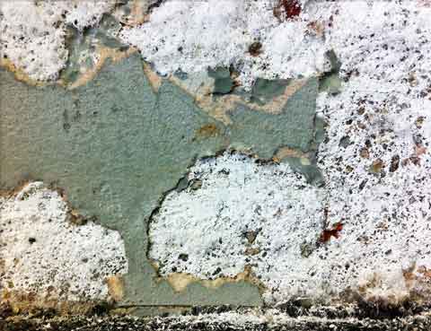 Paint peeling  from concrete efflorescence.